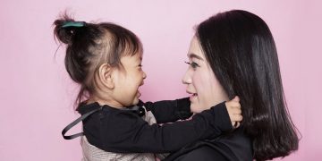 woman and children taking photo