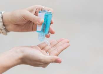 using hand sanitizer, your own