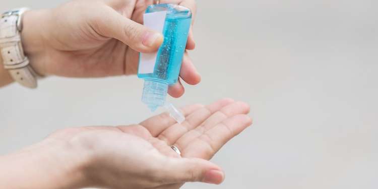 using hand sanitizer, your own