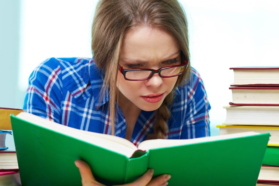 Diligent student being absorbed in studying